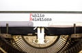 PR public relations symbol. Concept words PR public relations on white paper typed on retro typewriter. Beautiful white background Royalty Free Stock Photo