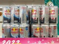 Many cans of Red bull energy drink on the shelf