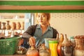 Soft focus, portrait of myanmar young girl with thanaka working in ceramic pottery shop. Singkhon border checkpoint. Thailand-