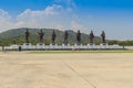 Prachuap Khiri Khan, Thailand - March 16, 2017: The bronze statues of seven Thai kings in the mountain and blue sky background Royalty Free Stock Photo