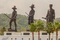 Prachuap Khiri Khan, Thailand - March 16, 2017: The bronze statues three of seven Thai kings in the mountain and blue sky Royalty Free Stock Photo