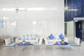 Prachuap Khiri Khan, Thailand-November 10, 2020: cozy sofas with blue shade colors of pillows and table in waiting area