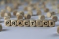 Practice - cube with letters, sign with wooden cubes