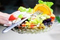Practice dipping fresh healthy fruit salad