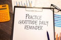 Practice gratitude daily reminder - inspirational handwriting on a napkin.