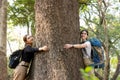 Woman hugging a big tree in the outdoor forest, Ecology and nature. Royalty Free Stock Photo