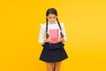 Practice and improve reading skills for school studies. Back to school concept. Girl hold book. School girl on yellow Royalty Free Stock Photo