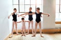 Practice makes every pointe perfect. a group of young ballerinas teaching a little girl ballet in a dance studio. Royalty Free Stock Photo