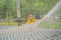 practice nets playground. boy plays in the playground shielded with a protective safety net. concept of children on line Royalty Free Stock Photo