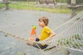 practice nets playground. boy plays in the playground shielded with a protective safety net. concept of children on line Royalty Free Stock Photo