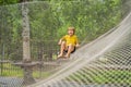 practice nets playground. boy plays in the playground shielded with a protective safety net. concept of children on line Royalty Free Stock Photo