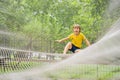 practice nets playground. boy plays in the playground shielded with a protective safety net. concept of children on line Royalty Free Stock Photo