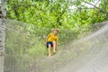 practice nets playground. boy plays in the playground shielded with a protective safety net. concept of children on line Royalty Free Stock Photo