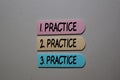 Practice. Practice. Practice write on sticky notes isolated on the tables
