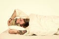 Practice relaxing bedtime ritual. Man with sleepy face lay on pillow. Fast asleep concept. Man with beard relaxing