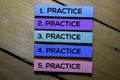 Practice. Practice. Practice text on sticky notes isolated on the tables