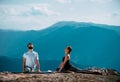 Practices yoga and meditates on mountains, peak Royalty Free Stock Photo