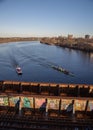 Practicing along the Charles river in Boston preparing to go under a railway bridge Royalty Free Stock Photo