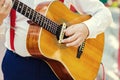 Practicing in playing guitar. Handsome young men playing guitar,Closeup of blurry male hands playing the guitar,music concept Royalty Free Stock Photo