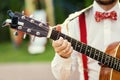 Practicing in playing guitar. Handsome young men playing guitar,Closeup of blurry male hands playing the guitar,music concept Royalty Free Stock Photo