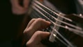 Practicing in playing guitar. Handsome young men playing guitar. Play the guitar. Hands playing guitar in diagonal Royalty Free Stock Photo