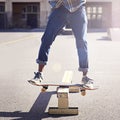 Practicing some cool tricks. a young man doing a skateboarding trick. Royalty Free Stock Photo