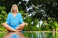 Practicing yoga outdoors Royalty Free Stock Photo