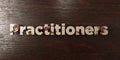 Practitioners - grungy wooden headline on Maple - 3D rendered royalty free stock image