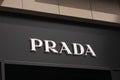 Prada logo on front store in shopping street. Prada is a world famous fashion brand founded in Italy.