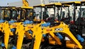 JCB logos on the mini excavators boom outside the official dealer.