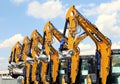 Booms of Sany excavators in a row outside the official dealer . Royalty Free Stock Photo