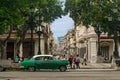 The Prado Boulevard is one of the main streets of Havana. View of the intersection, retro car, people walking.