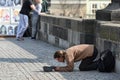 Prague. Beggar on Charles Bridge.
