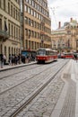 Vertical view of a number 8 tram loading passengers onboard