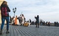 Prague, Bohemia / Czech Republic - November 2017: Tourists making photos of animators dressed as medieval knights