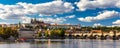 Prague Castle, Charles Bridge and boats on the Vltava river. View of Hradcany Prague Castle, Charles Bridge and a boats on the Royalty Free Stock Photo