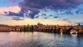 Prague Castle, Charles Bridge and boats on the Vltava river. View of Hradcany Prague Castle, Charles Bridge and a boats on the Royalty Free Stock Photo