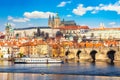 Prague Castle, Charles bridge, Mala Strana district and sightseeing touristic ship during summer sunny day in Prague, Czech