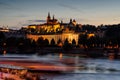 Prague castle in Hradcany with Vlatava river and lights from boats Royalty Free Stock Photo