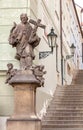 Prague castle steps with a religious statue