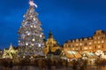 Prague Christmas market on the night in Old Town Square. Tyn Church, Bohemia. Blurred people on the move. Prague, Czech Republic. Royalty Free Stock Photo
