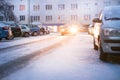 Prague city street under the snow. Cars driving on a blizzard road. Snow calamity in the city. Snow covered cars. Winter Royalty Free Stock Photo