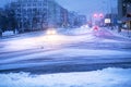 Prague city street under the snow. Cars driving on a blizzard road. Snow calamity in the city. Snow covered cars. Winter Royalty Free Stock Photo