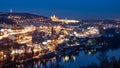 Prague cityscape by night with illuminated Prague Castle and Vltava River