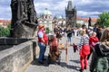 Prague, Czech - July 30, 2007 - A funny man with a barrel organ on the Charles Bridge over Vltava river Royalty Free Stock Photo