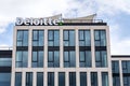 Deloitte professional service company network logo on headquarters
