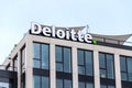 Deloitte professional service company network logo on headquarters