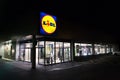 LIDL company logos at night on supermarket building from German chain