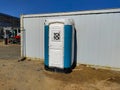 Movable toilet on the construction site during sunny weather