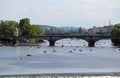 Prague, Czech Republic - August 23, 2016: Long Bridge over Vltava river and many boats Royalty Free Stock Photo